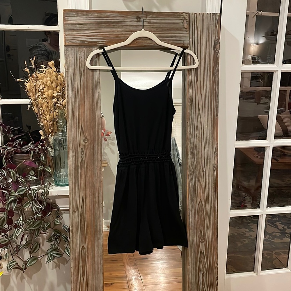 Super fun black romper with peep hole tummy